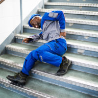 man falls on poorly maintained staircase