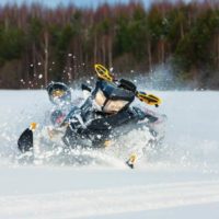 rider falling off snowmobile